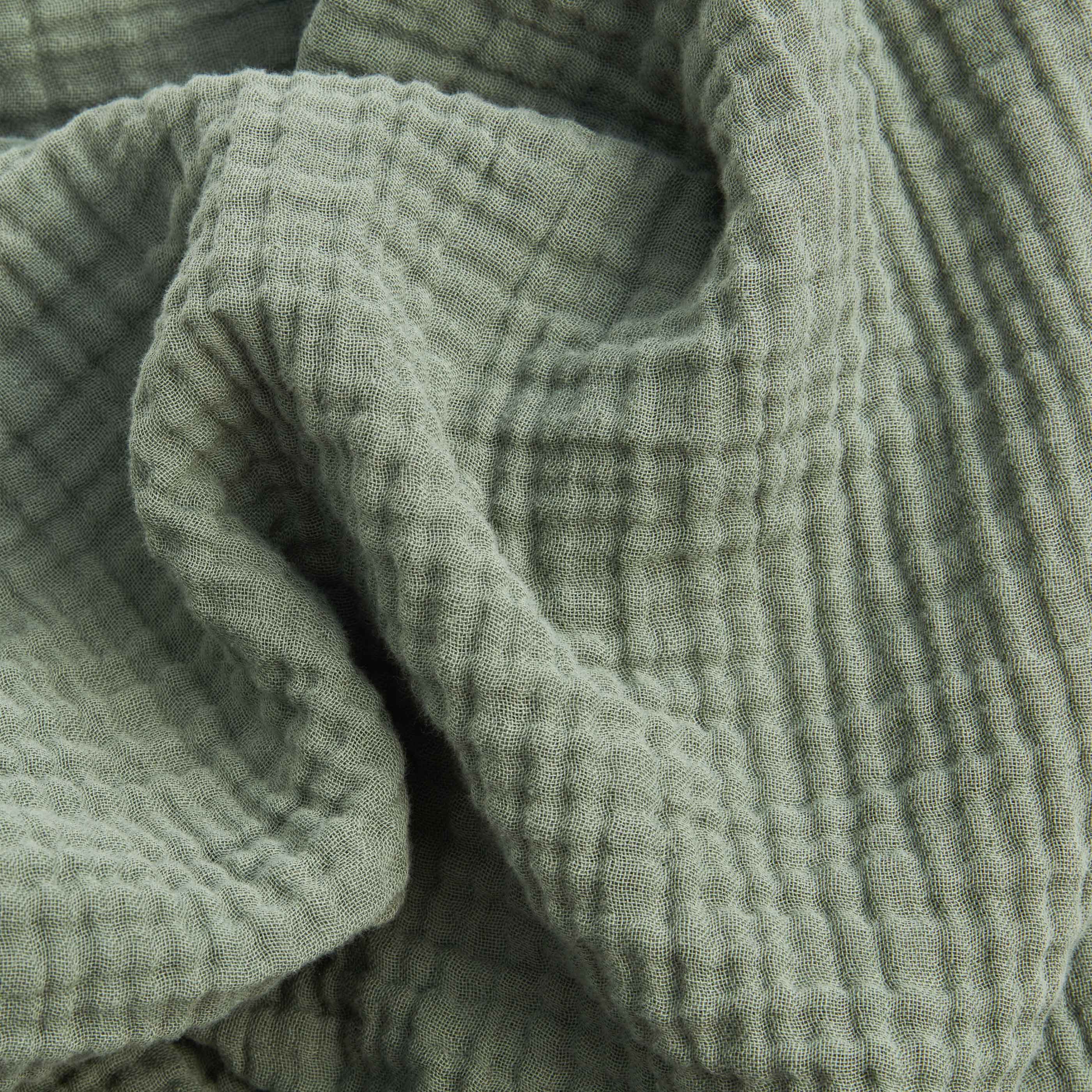 Strukturierte Musselin‑Bettwäsche aus weicher Baumwolle in Naturton.